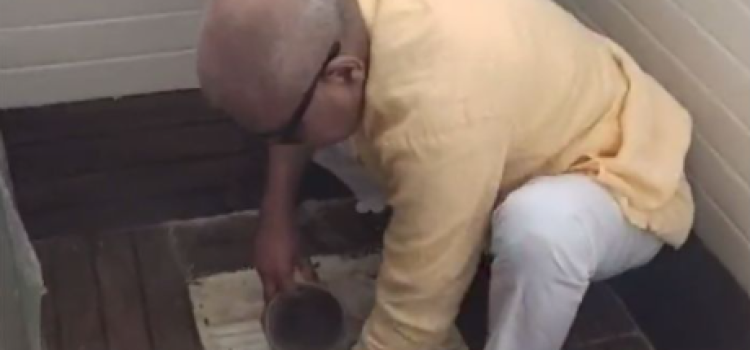 BJP MP Janardan Mishra cleans toilet with bare hands at girls' school in MP