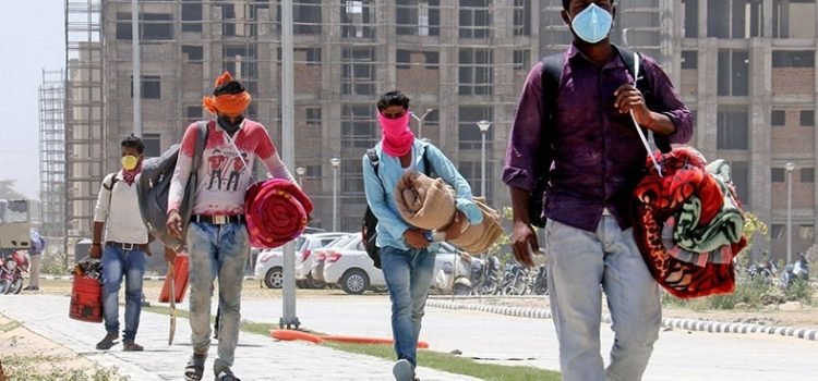 BATHINDA, INDIA - MAY 21: Construction workers of AIIMS Bathinda??carrying their belongsings to return home since the construction activity has been halted during the nationwide lockdown on May 21, 2020 in Bathinda, India. (Photo by Sanjeev Kumar/Hindustan Times via Getty Images)